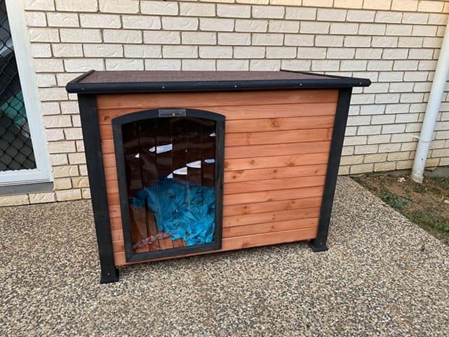 Haven Dog Kennel in a backyard.